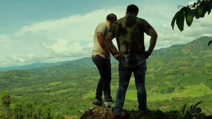Producers overlooking the coffee valley at Finca Las Brisas